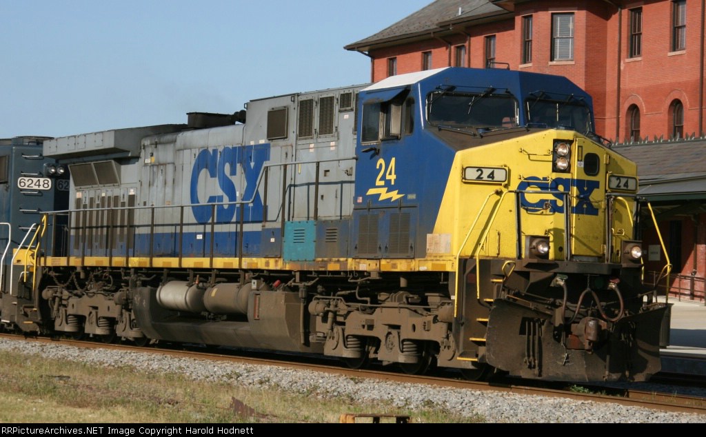 CSX 24 leads a train northbound past the station